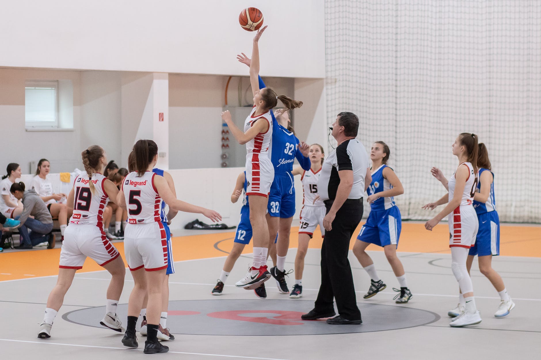 photo of women playing basketball